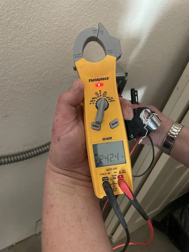 Voltage testing with clamp meter during Generator Installation in Blanchard
